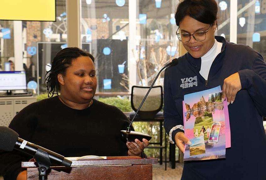 Librarian shows mood board project during visit by Camryn Garrett