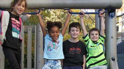 Lower School After School play - children on slide